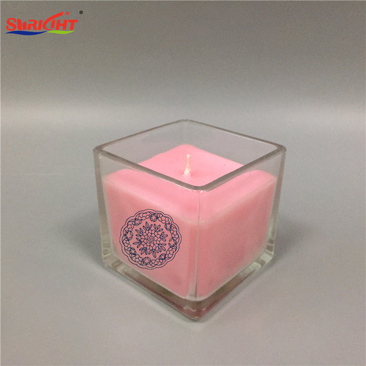Vela aromatizante en vaso cristal transparente con imagen original y cera rosa